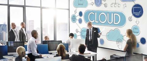 Man giving a talk about cloud computing at a conference