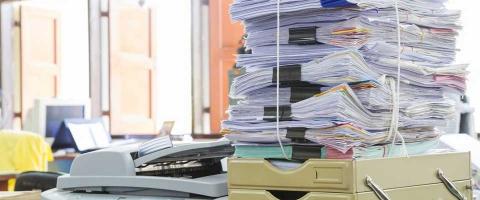 Stack of papers representing scanning options and benefits for large volumes