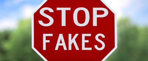 stop sign that say stop fakes conceptually representing counterfeit parts