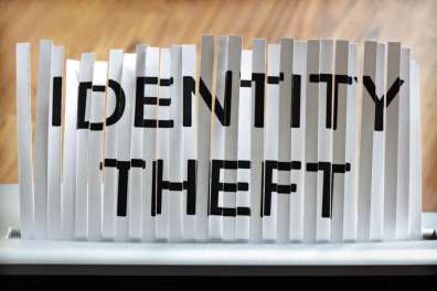 Stylized image with "Identity Theft" printed on a shredded piece of paper