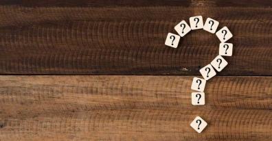 Question mark made out of scrabble tiles