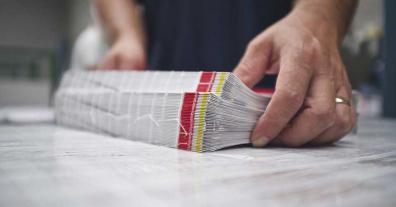 worker in in-house production print shop