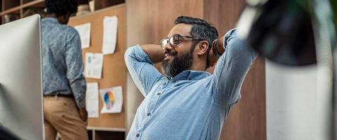 satisfied business man beard glasses mac