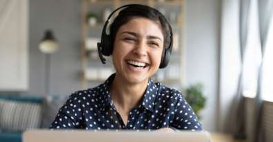 woman-in-headset-working-from-home-remotely