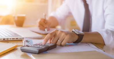 Businessman calculating total cost of ownership of a commercial copier