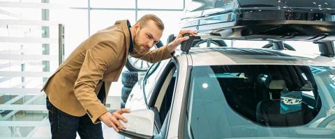 man shopping for cars