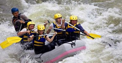 rafters on flowing river