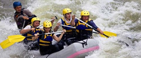 rafters on flowing river