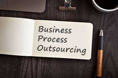 Notepad with "Business Process Outsourcing" written in ink