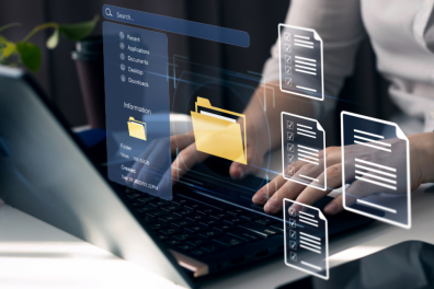 A professional working on a laptop with holographic icons displaying folders and documents, emphasizing a streamlined and efficient digital workflow. This visually represents the importance of documen